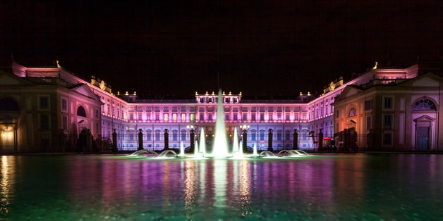 photo of Luxury classical palace illuminated with colourful lights under a dark night sky - Villa Reale di Monza, Royal Villa of Monza, Lombardy, Italy, Europe