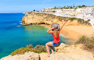 Photo of wide sandy beach in white city of Albufeira, Algarve, Portugal.