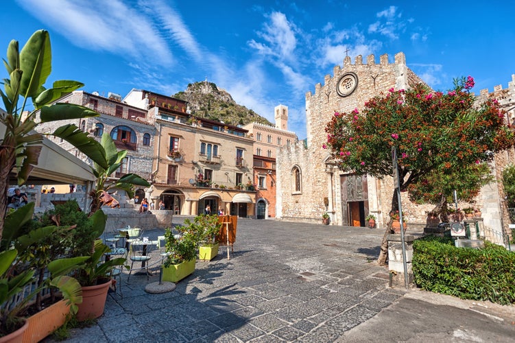 Photo of Townscape of Taormina with cathedral, square and the hill with other buildings, Italy.