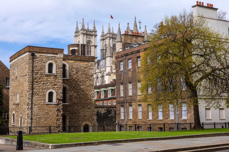 photo of the historic Jewel Tower with Westminster Abbey in the background, in the City of Westminster, London, UK.