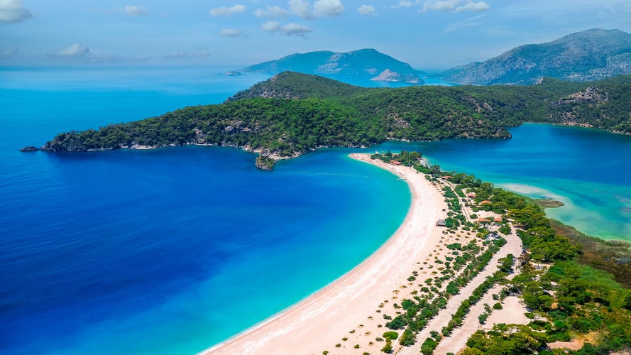 Photo of aerial view beautiful blue Lagoon and beach in Oludeniz Fethiye, Turkey.