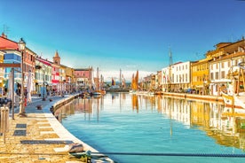 Photo of Cervia's canal, where the Salt Museum is located, with reflections on the water ,Italy.