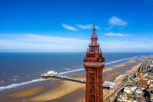 Photo of aerial view of the famous Blackpool Tower and beach on a beautiful Summer day on one of Great Britains most popular holiday destinations, England.