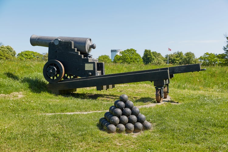 photo of view of Old bronze cannon on rampart in city Fredericia, Denmark.