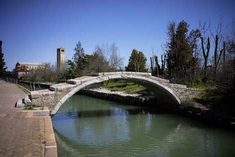 photo of view of Ponte del diavolo - Devil's Bridge in tiny Torcello island, near Venice, Italy.