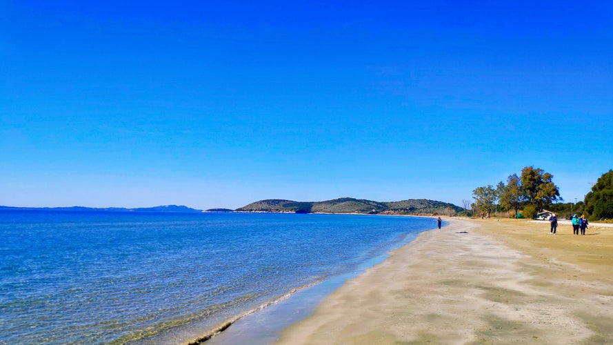 photo of Igoumenitsa Beach drepanos sand and sea waves under the blue sky tourist place and attraction beautiful in Igoumenitsa city Greece Thesprotia close to Parga Preveza and Sivota Epirus Europe seascape.