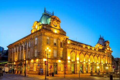 Photo of night view of sao bento station in porto, portugal.