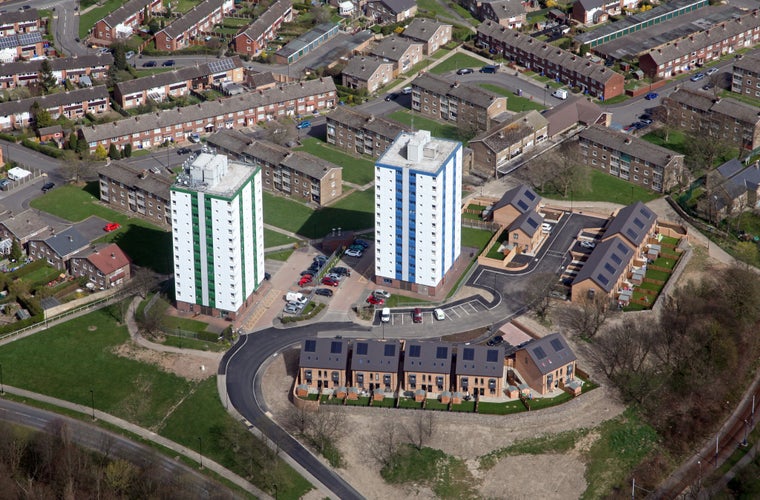 aerial view of two blocks of flats in Sheffield, and new housing