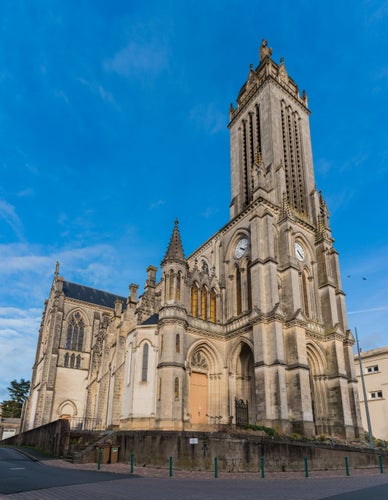 photo of view of A vertical panorama of the Saint Peter Church in Cholet, France.