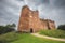 Photo of Historic 14th century medieval Doune Castle, with a dark, moody, dramatic sky in Perthshire, Scotland.