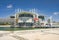 Photo of the big Lisbon oceanarium (aka Oceanario de Lisboa) building on pier in an artificial lagoon at Tagus river, Portugal.