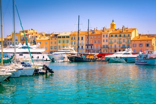 Photo of beautiful aerial view of Saint-Tropez, France with seascape and blue sky.