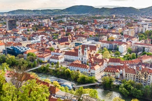 Photo of a view of the Alps from the Ehrwald, a town on the border of Germany and Austria with picturesque meadows surrounded by towering mountain ranges, including the Zugspitze.