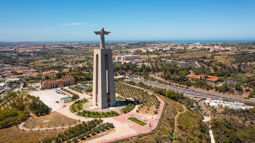 Photo of Catholic Statue with Jesus Christ in Almada near 25 de Abril bridge.