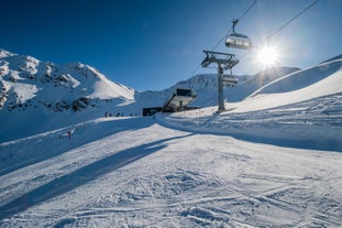 Photo of The mountain village at the Austrian ski resort Soelden on a cold and sunny winter day.