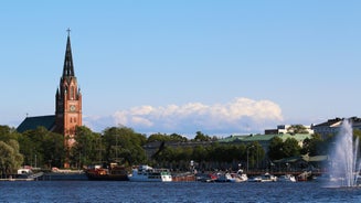 Aerial view of the Tampere city at sunset. Tampella building. View over Tammerkoski river in warm sunlight.