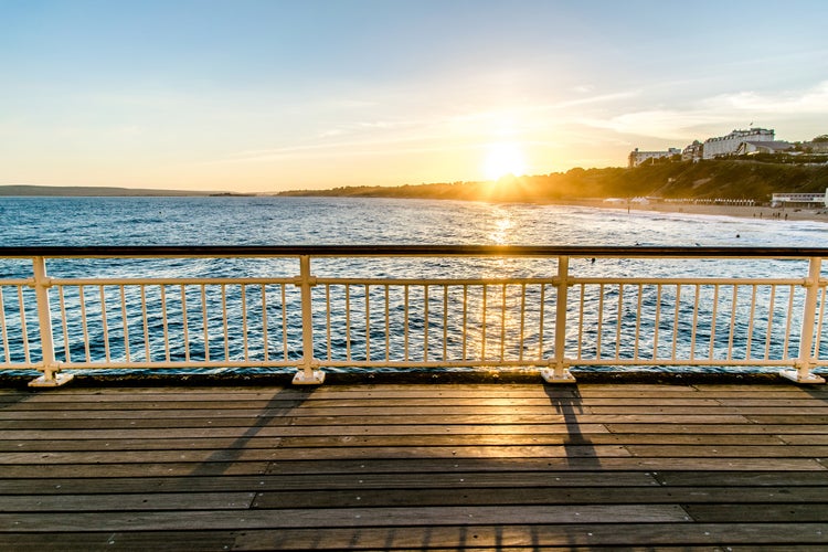 Photo of the view from Bournemouth Pier taken in the evening with the beautiful sunset.