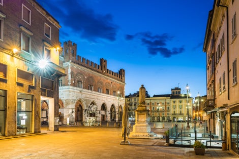 Photo of Piazza Cavalli (Square horses) and palazzo Gotico (Gothic palace) in the city center on a beautiful day, at dusk, Piacenza, medieval town, Italy.