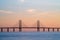 The Oresund Bridge is a combined motorway and railway bridge between Sweden and Denmark (Malmo and Copenhagen). Long exposure. Selective focus.