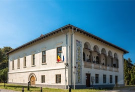 Photo of the facade of the Administrative Palace of Craiova (today Dolj Prefecture and County Council), an imposing historical monument located on the territory of Craiova, Romania.