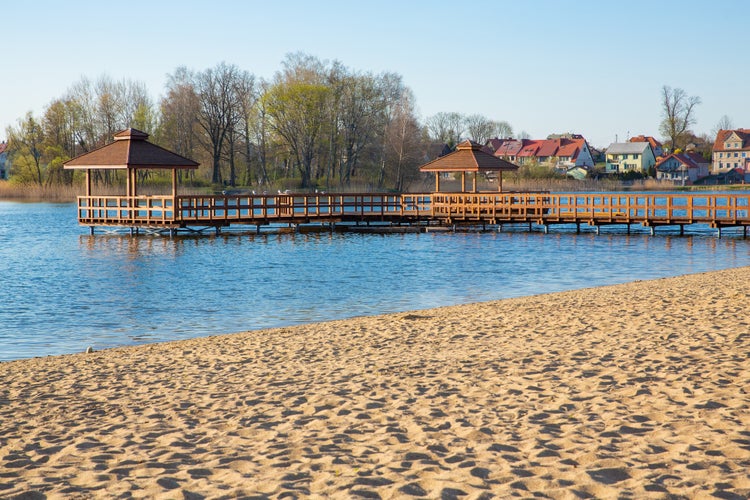 Photo of Idyllic lake and sand beach in Szczytno, Masuria, Poland.