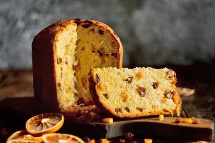 Traditional Italian panettone, a tall, dome-shaped sweet bread filled with dried fruits.jpg