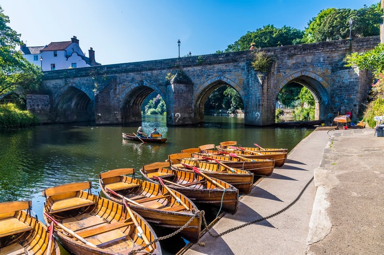 photo of view of A view along the River Wear towards the Elvet Bridge in Durham, UK in summertime.