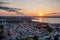 Photo of great panorama Skyline view from above Huskvarna city and Lake Vattern during magical warm reflecting Sunset over lake near Jonkoping, Sweden.