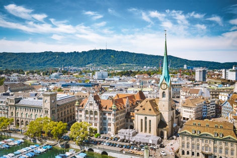 photo of aerial panoramic view of Zurich city center with famous Fraumunster Church and river Limmat at Lake Zurich from Grossmunster Church, Canton of Zurich, Switzerland.
