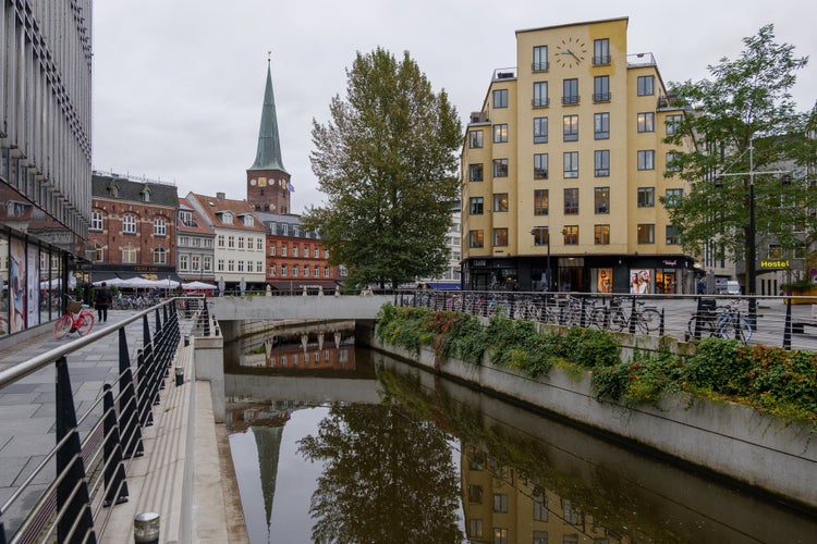 Outdoor exterior view of the old town and shopping walking district along canal in Aarhus, Denmark.