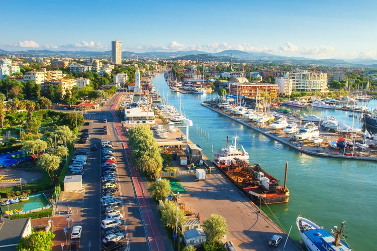 Photo of Aerial view on Rimini. Italian cityscape from above. Lighthouse on water sea canal. Rimini city. Summer vacation.