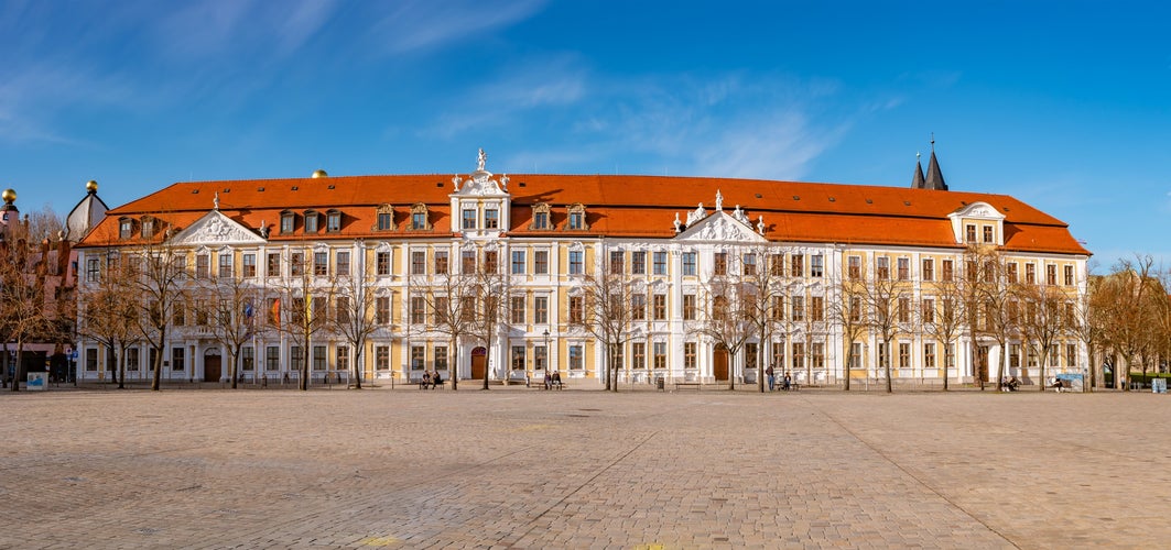 Panoramic view over major square with fountains in Magdeburg by Cathedral and Government Office, at sunny day and blue sky