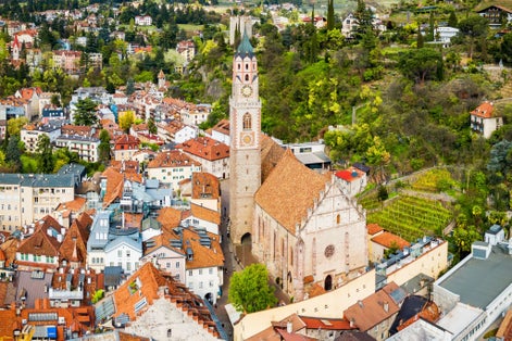 St. Nicholas Church aerial panoramic view in Merano. Merano or Meran is a town in South Tyrol in northern Italy.