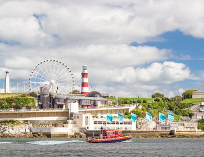 Photo of Plymouth Hoe ,Somerset Fire ,Rescue Services Launch Boat and Smeaton's Tower in Plymouth Sound Sailing Past the Hoe, UK.