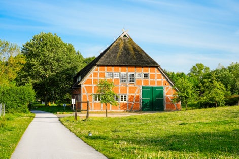 Old farm barn in the city of Wismar. Historic half-timbered house.