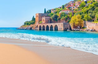 Photo of Kizil Kule or Red Tower and port aerial panoramic view in Alanya city, Antalya Province on the southern coast of Turkey.