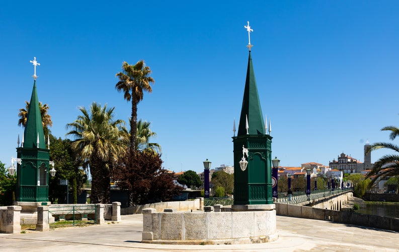 Photo of Urban landscape of city of Mirandela in the north of Portugal with the banks of the river Tua with the traditional Roman bridge.