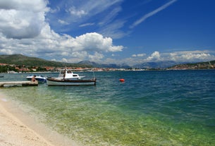 photo of a beautiful panoramic view of Kastel Luksic harbor and landmarks summer view, Split region of Dalmatia, Croatia.