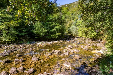 photo of river with many waterfalls in Areuse gorges in Switzerland.