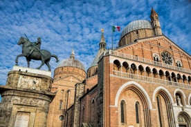 Photo of beautiful view of canal with statues on square Prato della Valle and Basilica Santa Giustina in Padova (Padua), Veneto, Italy.