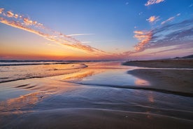 Photo of aerial view of Costa da Caparica coastline of glorious sandy beaches, powerful Atlantic waves, Portugal.