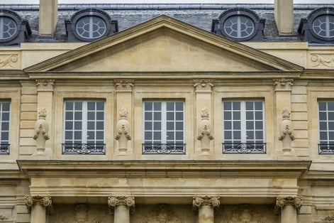 photo of External view of Archives Nationals (National Archives) buildings (old neo-classical mansion, the Hotel de Rohan-Soubise, 1705). District of Le Marais, Paris, France. 