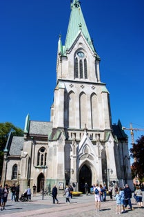 Photo of Kristiansand Cathedral on a clear day with blue sky, Norway.