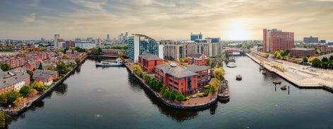 Aerial drone view of Manchester city in UK on a beautiful sunny day.