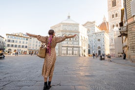 Photo of Italy Piazza Maggiore in Bologna old town tower of town hall with big clock and blue sky on background, antique buildings terracotta galleries.