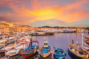 Photo of beautiful aerial view of Saint-Tropez, France with seascape and blue sky.