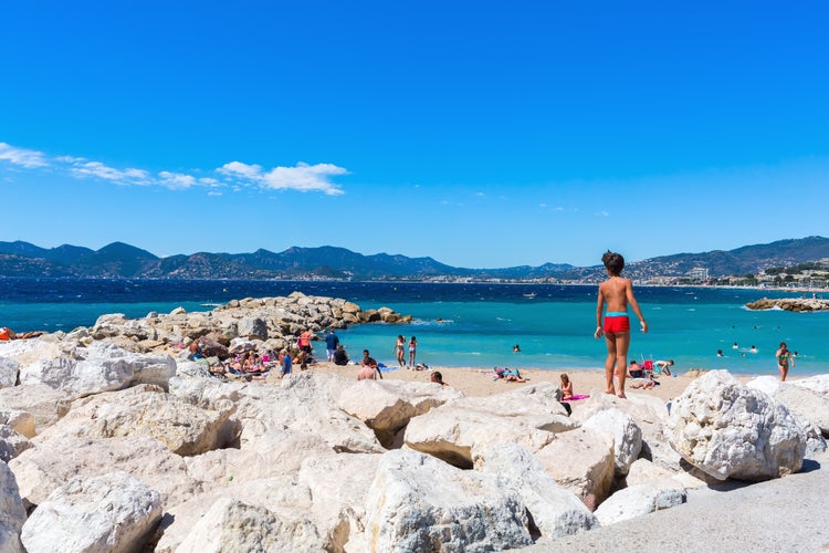 City beach of Cannes with unidentified people.