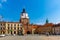 Picturesque Lublin cityscape with historic symbol of city - medieval brick gate Brama Krakowska in sunny spring day, Poland.