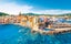 Photo of beautiful aerial view of Saint-Tropez, France with seascape and blue sky.