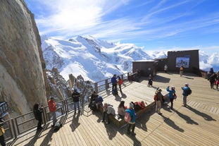 Photo of The winter view on the montains and ski lift station in French Alps near Chamonix Mont-Blanc.